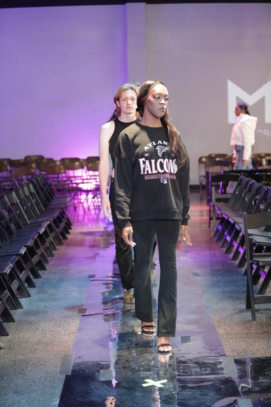 The audience takes in a runway look at Le Pasefika Runway 2025